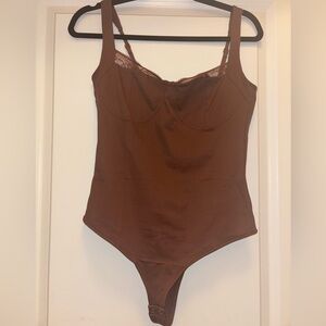 Brown bodysuit with lace detailing